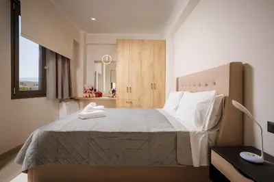 a bedroom with a large bed in a room at Polixenys home in Daratso