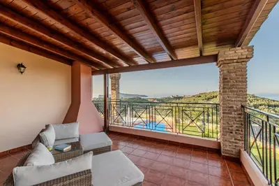 a room with a balcony with a view at Villa Trouli by Vintage Travel in Metókhi