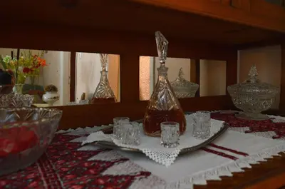 a table with glasses and a bottle on a table at Chania Vintage Escape - sea view Gem by old port in Chania Town