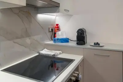 a kitchen with a sink and a counter top at Stelina Apartment in Chania Town