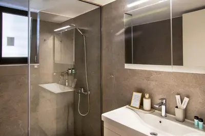 a bathroom with a shower and a sink at Stelina Apartment in Chania Town