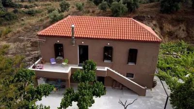an aerial view of a house with a roof at Telesilla's home in Apothíkai