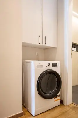 a white washer and dryer in a room at Theni City Apartment by Zen Estate in Chania Town