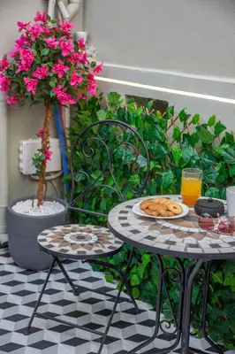 a table and chairs with a plate of food on it at Dreams 4 you in Chania Town