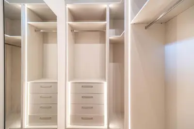 a walk in closet with white closets at Fantasea Villas, villa Lumi in Stérnai