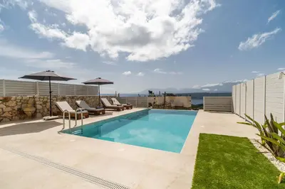 a swimming pool on the roof of a house at Fantasea Villas, villa Lumi in Stérnai