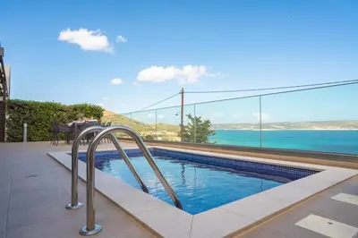 a swimming pool with a view of the ocean at Villa Orama - Sea view with private pool in Kalyves