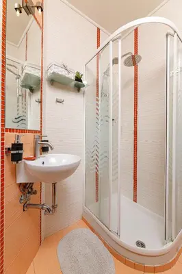 a bathroom with a shower and a sink at Lucia's Home in Stalos
