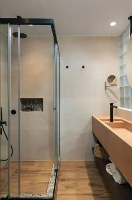 a shower with a glass door in a bathroom at Raviewha Luxury Apartments 2 in Ravdhoúkha
