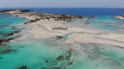an island in the ocean with the words web west at View West Elafonisi house in Livadia
