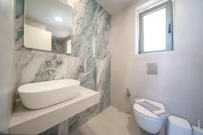 a bathroom with a sink and a toilet at Nafsika Xenia - Odysseus in Falasarna