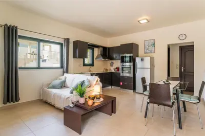 a living room with a couch and a table at Casa Barbara in Stalos