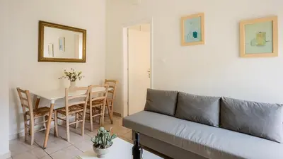 a living room with a couch and a table at Bella Apartment in Chania Town