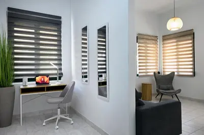 a home office with a desk and chairs and windows at El Dorado Corner with Hot Tub in Chania Town