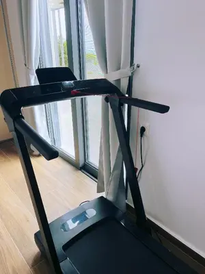 a treadmill in a room with a window at Luxury apartment Reverie in Sfakiá