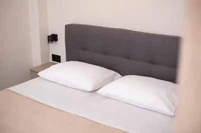 two white pillows sitting on a bed in a room at Nektaria Studio in Chania Town