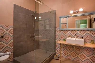 a bathroom with a shower and a sink at TheJoy in Chania Town
