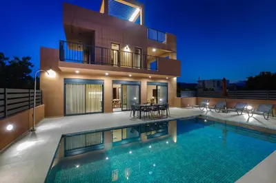 a house with a swimming pool in front of a house at Madre Tierra Boutique Villa 1 in Liyidhés
