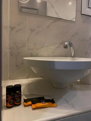a bathroom with a sink and a counter with a towel at Tile apartments 1 in Agia Marina Nea Kydonias