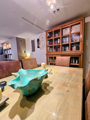a table with a large bowl on top of it at Zen House with Fairytale Garden & Sea View in Daratso