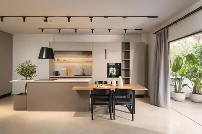 a kitchen with a wooden table and chairs in a room at Nea Chora Boutique Apartment in Chania Town