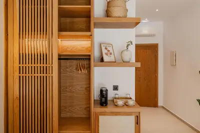a room with a closet with wooden shelves at Sarana Suites Crete in Kissamos