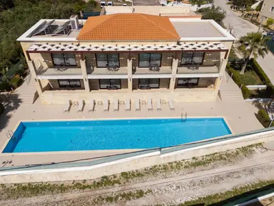 an aerial view of a house with a swimming pool at Altirina Studios in Almirida