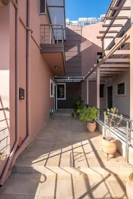 an empty hallway of a building with potted plants at Angela Home, 5Street, Perivolia in Perivólia