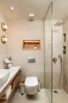 a bathroom with a toilet and a glass shower at Kydoni Signature Apartment in Chania Town