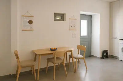 a dining room table and chairs in a kitchen at Yalos Standard Studio - 5 mins to Elafonisi beach in Agios Padeleimon