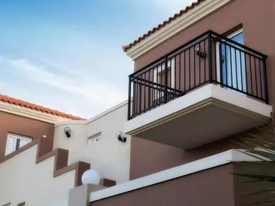 a balcony on the side of a house at Lito Beach Hotel in Gerani Chanion
