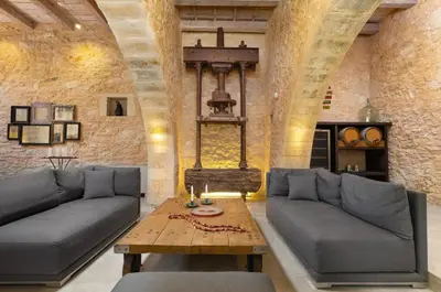 a living room with a couch and a table at Villa Athermigo in Gavalochori