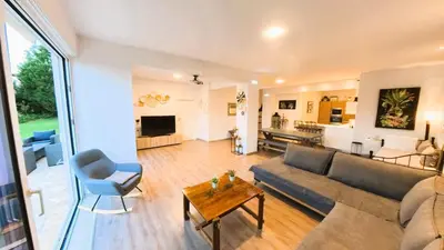 a living room with a couch and a table at MG Residence Boutique Holiday Home in Korakiaí