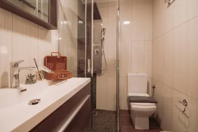a bathroom with a shower and a toilet and a sink at Semeli House in Chania Town