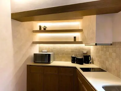 a kitchen with a counter top with a microwave at Venetian Harbour Residence in Chania Town