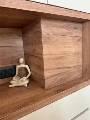 a wooden doll sitting in a wooden drawer at Venetian Harbour Residence in Chania Town