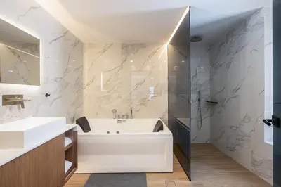 a bathroom with a tub and a sink and a shower at Versante Rousso - Modern Living in Nature's Embrace by etouri in Káïna