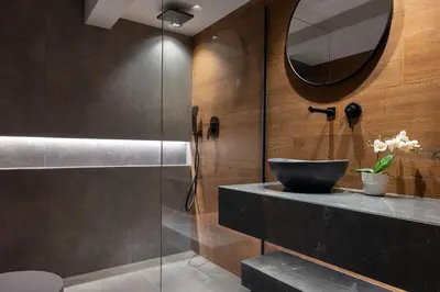 a bathroom with a sink and a glass shower at Luxurious Villas Rocca Blanco 1 & 2 in Kounoupidhianá