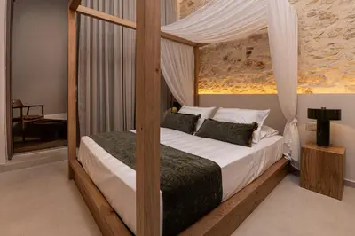 a bedroom with a bed with a canopy at Madonna del Mare City in Chania Town