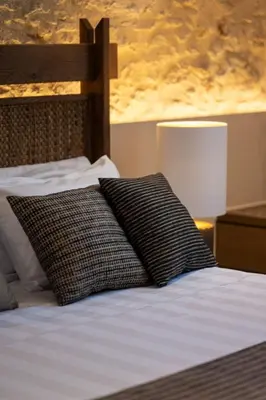 a bed with two pillows on top of it at Madonna del Mare City in Chania Town