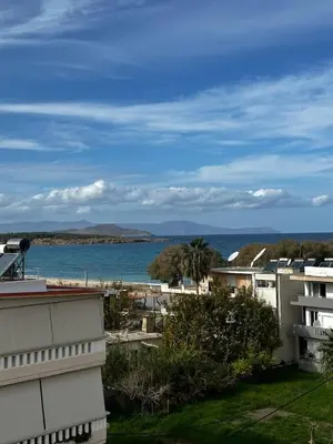 a view of the ocean from a balcony of a building at Sea View appartment in Chania Town