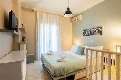 a bedroom with a bed with towels on it at Solena in Tsikalariá