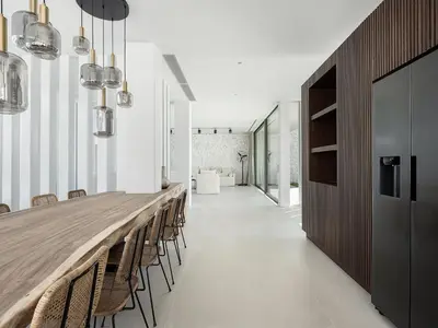 a long dining room with a long table and chairs at Nature & Beauty Villa in Xirostérnion