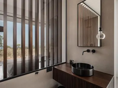 a bathroom with a sink and a mirror at Nature & Beauty Villa in Xirostérnion