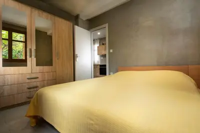 a bedroom with a large white bed in it at Rianou Apartment in Chania Town