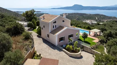 an aerial view of a house with a swimming pool at Marathi Hilltop Oasis Sea View Villa in Marathi