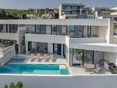 an aerial view of a house with a swimming pool at Bella Casa - Newly Built Designer Villa in Kalyves