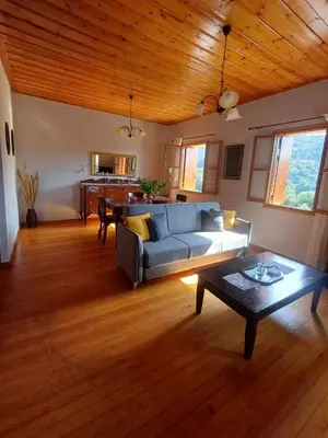 a living room with a couch and a table at Olive Stone in Kamisianá