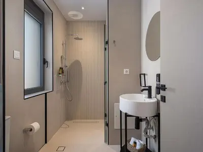 a bathroom with a sink and a shower at Villa Thimi - Luxury Family Villa - Private Pool in Korakiaí