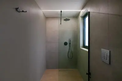 a bathroom with a shower with a glass door at Madre Tierra Boutique Villa 2 in Liyidhés
